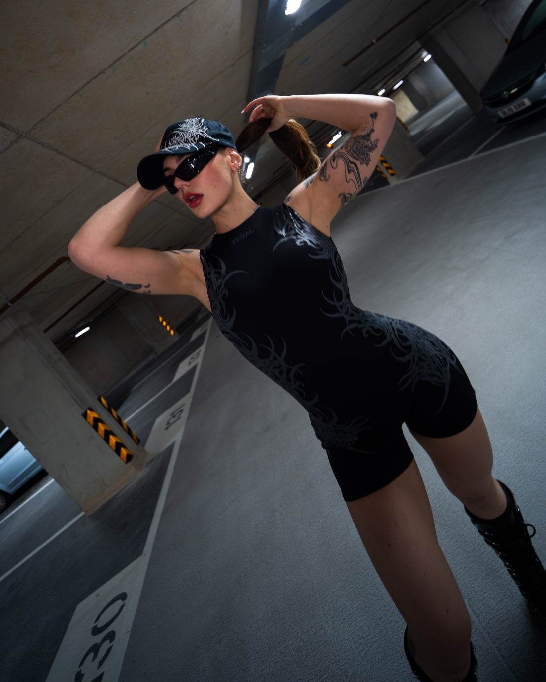 BLACK FERAL SIGILISM ONE-PIECE ROMPER