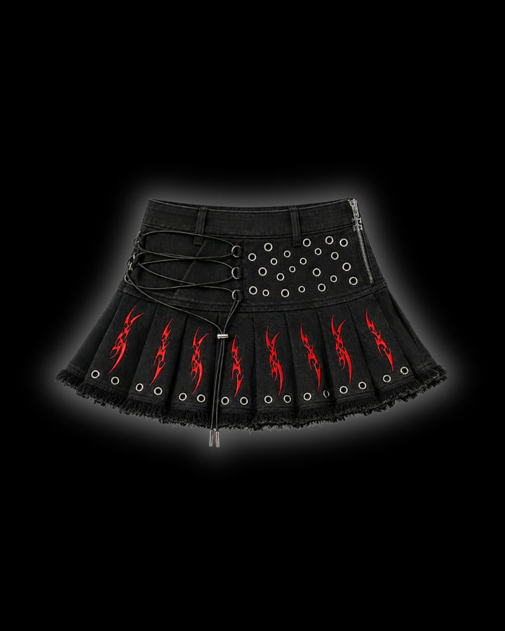 FERAL Sigilism mini skirt front - pleated black denim with red cyber-sigilism embroidery, elasticated lace-up front and metal eyelet detailing