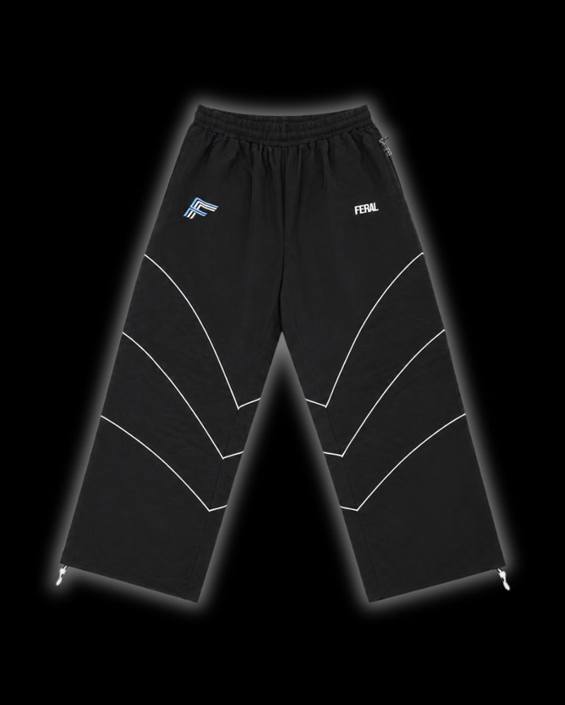 TRIBAL RACER TRACK PANT blue front wide-leg reflective chevron piping drawstring ankle cuffs FERAL hip logo F monogram