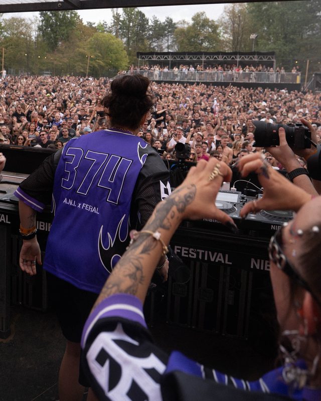 The 374 on the back of the purple jersey, at the decks facing the crowd