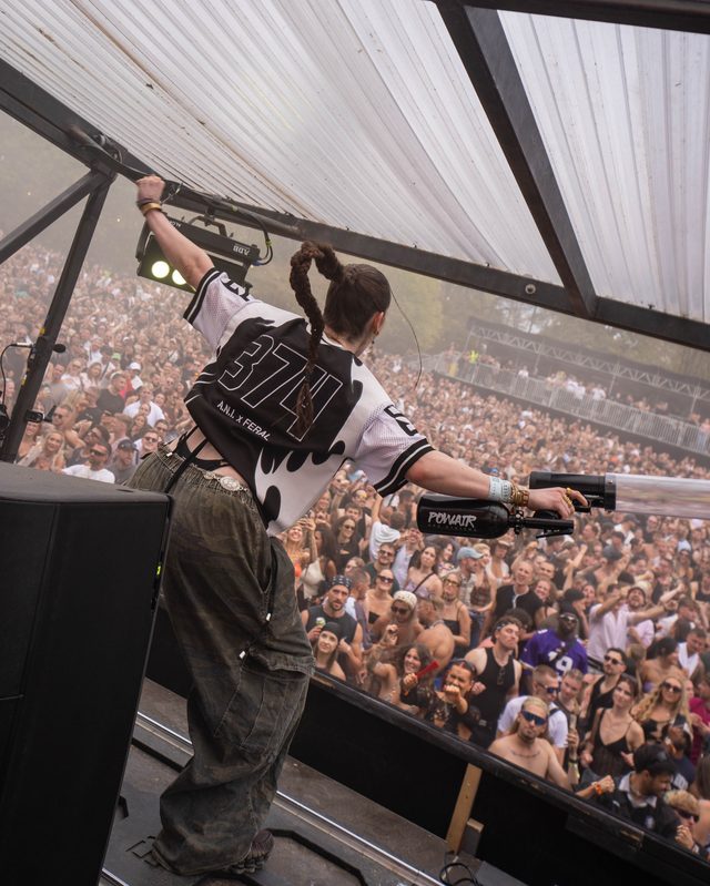 The 374 on the back of the monochrome jersey, on stage over the crowd