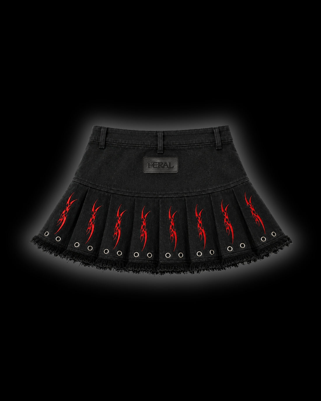 FERAL Sigilism mini skirt back - black denim pleats with red cyber-sigilism embroidery, embroidered FERAL leather patch and belt loops