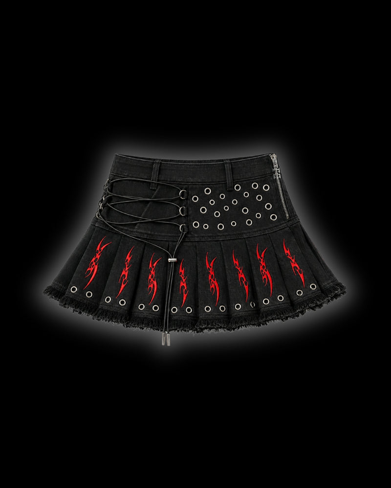 FERAL Sigilism mini skirt front - pleated black denim with red cyber-sigilism embroidery, elasticated lace-up front and metal eyelet detailing