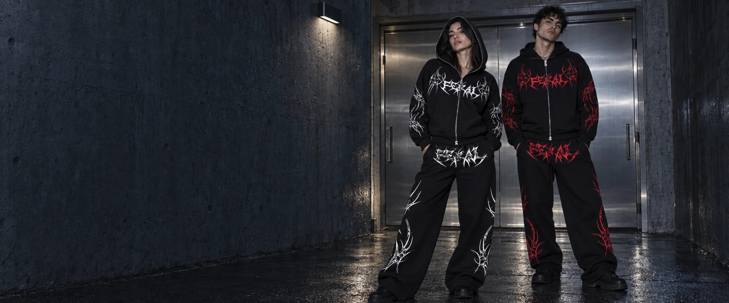 FERAL ROGUE black zip hoodies with white and red sigil artwork, styled with matching wide-leg sweatpants